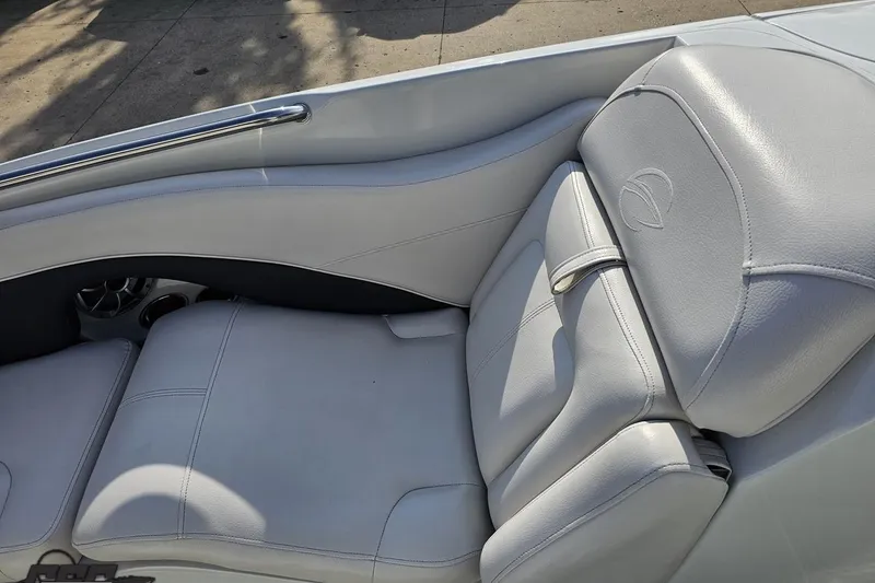 Slide: The Image of 2019 Crownline 275 SS boat interior with luxurious white leather seating. - 100