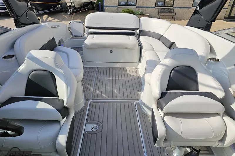 Slide: The Image of 2019 Crownline 275 SS boat interior with luxurious white seating and sleek design. - 104