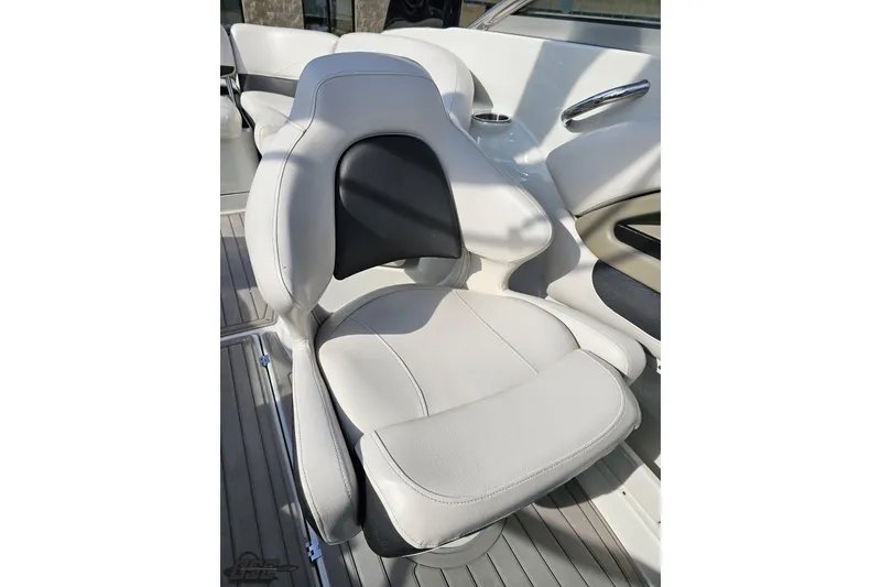 Slide: The Image of 2019 Crownline 275 SS boat seat, white and black upholstery, modern design. - 105