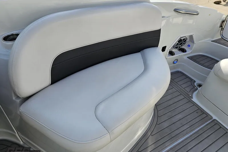 Slide: The Image of 2019 Crownline 275 SS boat interior seating with cup holders and speaker system. - 108