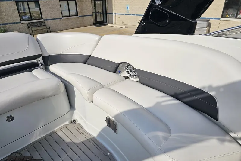 Slide: The Image of 2019 Crownline 275 SS boat interior with white and gray seating, showcasing modern design. - 110