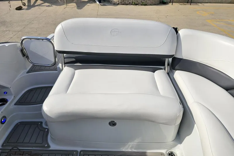 Slide: The Image of 2019 Crownline 275 SS boat interior with white seating and sleek design. - 115