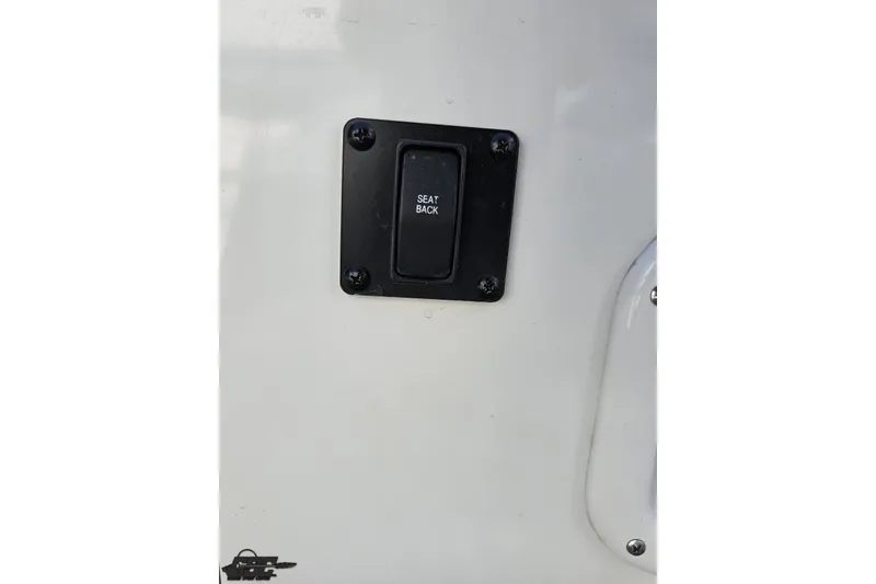 Slide: The Image of Crownline 275 SS 2019 seat back switch on boat interior panel. - 118