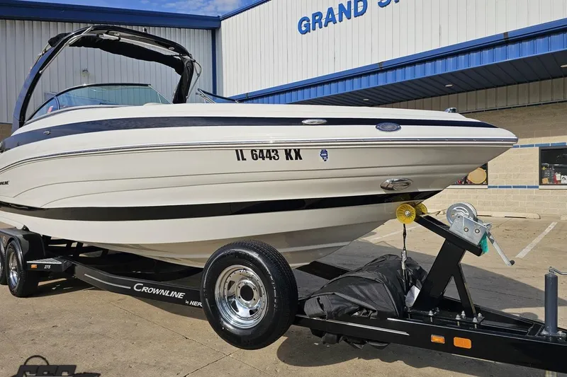 Slide: The Image of 2019 Crownline 275 SS boat on trailer outside dealership. - 18