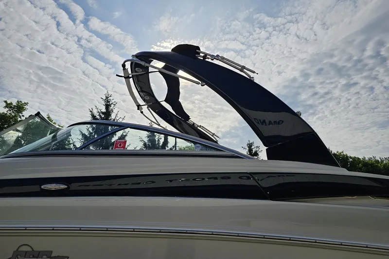 Slide: The Image of 2019 Crownline 275 SS boat against a cloudy sky backdrop. - 28