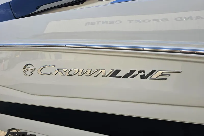 Slide: The Image of 2019 Crownline 275 SS boat logo on sleek white hull. - 33