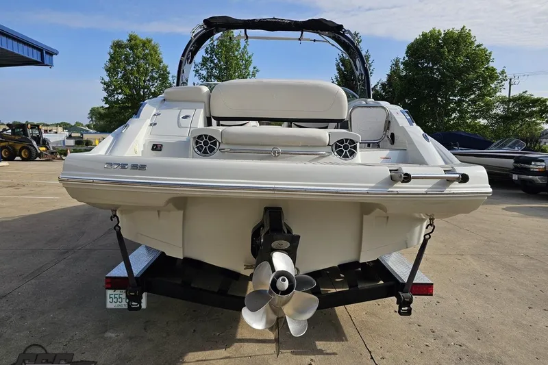 Slide: The Image of 2019 Crownline 275 SS boat rear view on trailer, outdoor setting. - 37