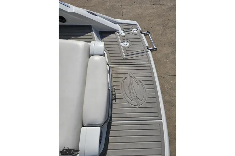 Slide: The Image of 2019 Crownline 275 SS boat deck with cushioned seating and textured flooring. - 44