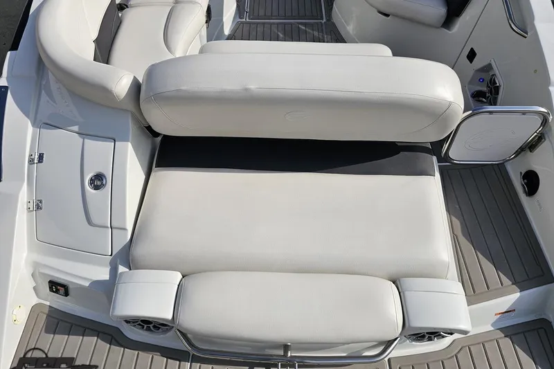 Slide: The Image of 2019 Crownline 275 SS boat interior with white leather seating and sleek design. - 48
