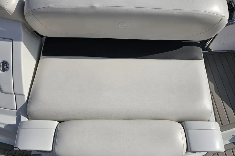 Slide: The Image of 2019 Crownline 275 SS boat seat, featuring sleek white upholstery. - 49