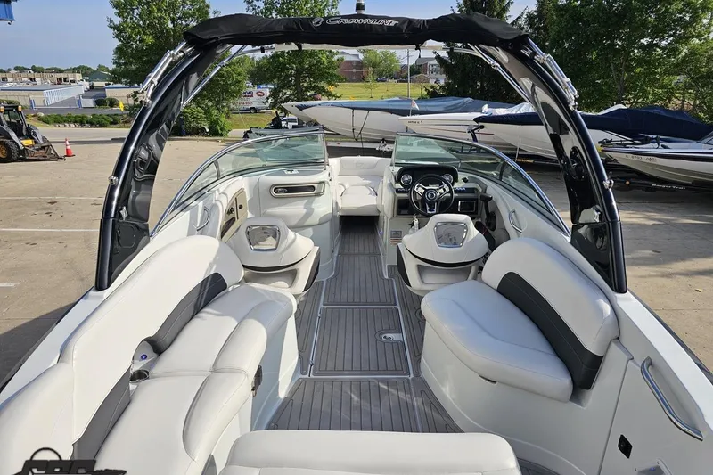 Slide: The Image of 2019 Crownline 275 SS boat interior with white seating and modern dashboard. - 51
