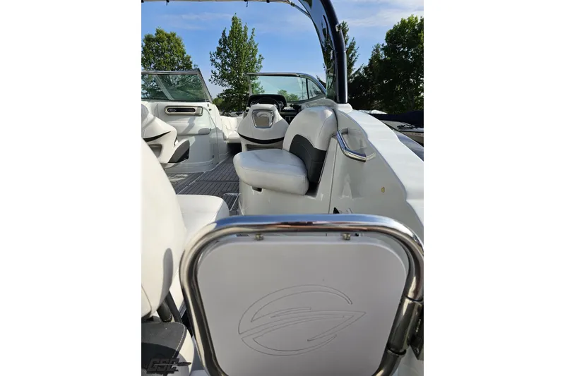 Slide: The Image of 2019 Crownline 275 SS boat interior with white seating and sleek design. - 52