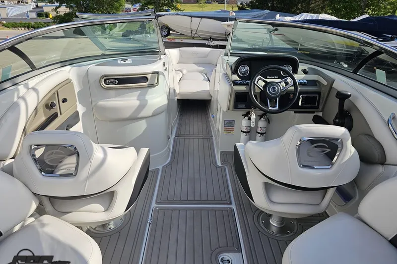 Slide: The Image of 2019 Crownline 275 SS boat interior with luxurious seating and modern dashboard. - 56