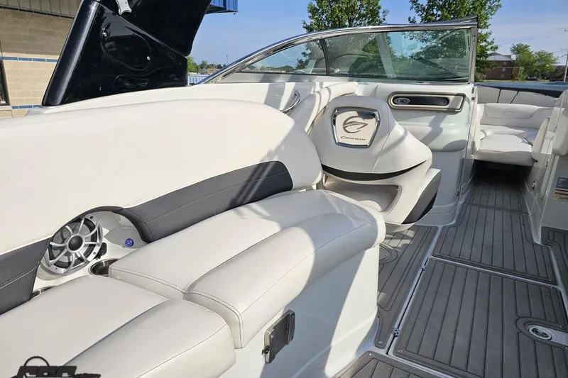 Slide: The Image of 2019 Crownline 275 SS boat interior with white seating and modern dashboard design. - 57