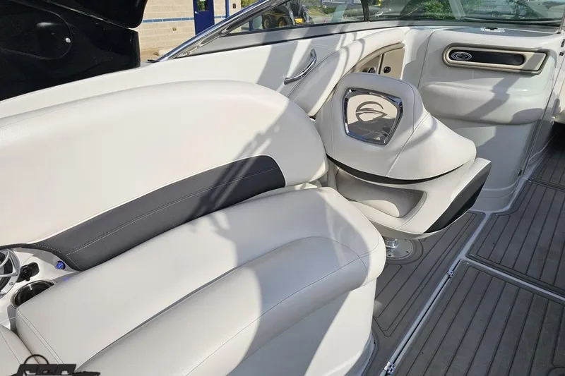 Slide: The Image of Interior of a 2019 Crownline 275 SS boat, featuring sleek white seating and modern design. - 58