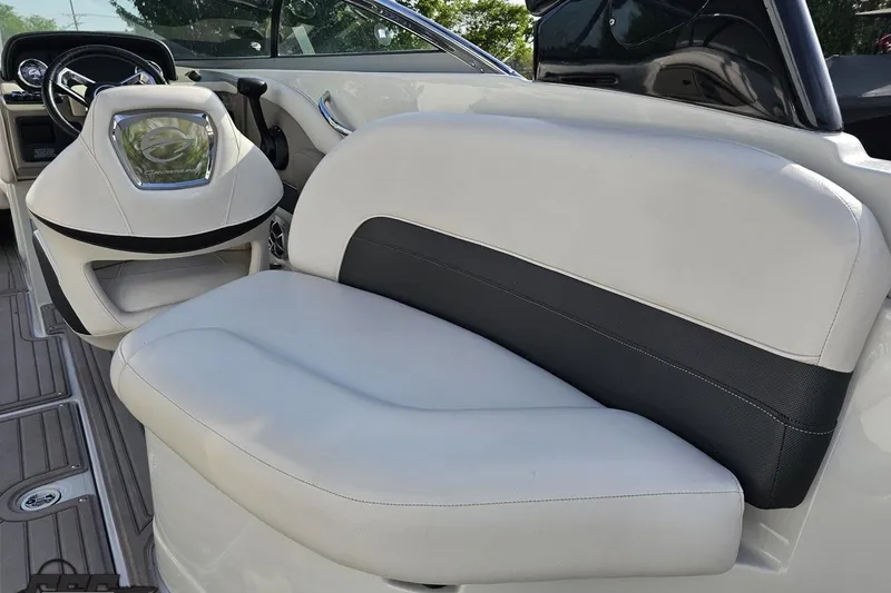 Slide: The Image of 2019 Crownline 275 SS boat interior with white and black seating. - 59