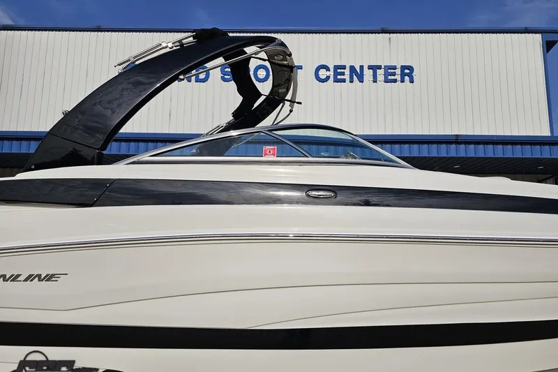 Slide: The Image of 2019 Crownline 275 SS boat displayed at a marine center. - 6