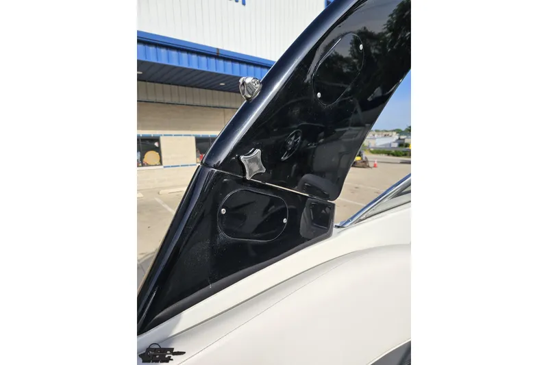 Slide: The Image of 2019 Crownline 275 SS boat detail, showcasing sleek black and white design elements. - 62