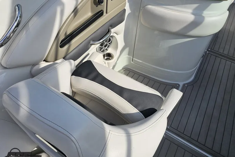 Slide: The Image of 2019 Crownline 275 SS boat interior with white and black seating. - 67