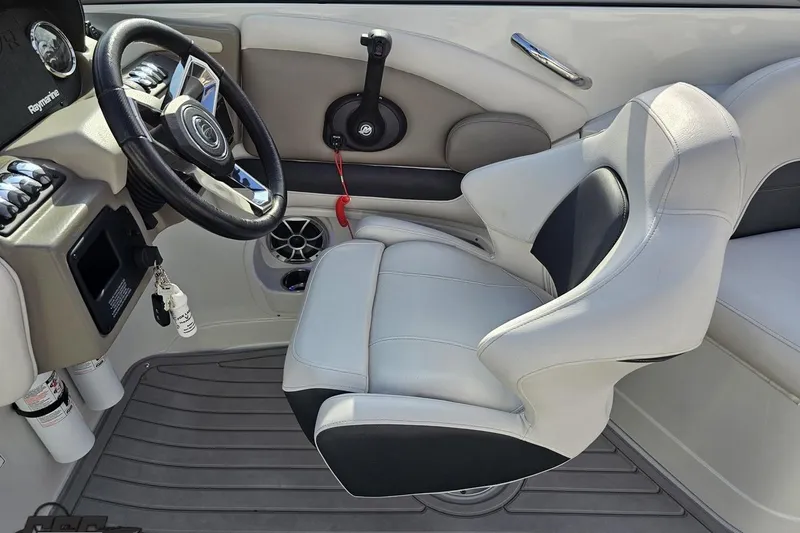 Slide: The Image of 2019 Crownline 275 SS boat interior with steering wheel and captain's seat. - 73