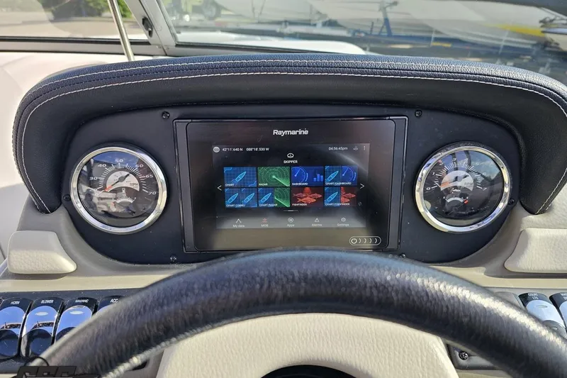 Slide: The Image of Dashboard of 2019 Crownline 275 SS boat with Raymarine display and gauges. - 78