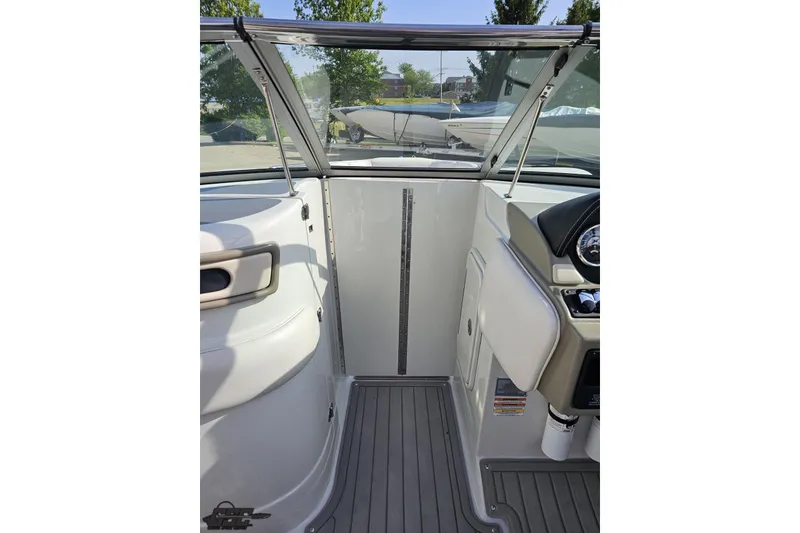 Slide: The Image of 2019 Crownline 275 SS boat interior with sleek design and modern dashboard. - 85