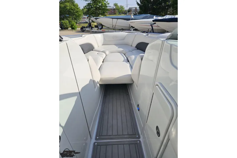 Slide: The Image of 2019 Crownline 275 SS boat interior with white seating and sleek design. - 86