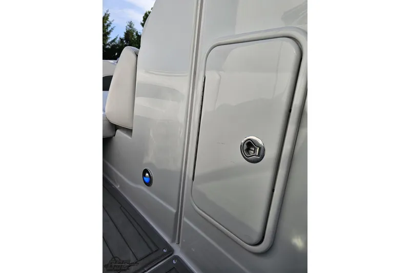 Slide: The Image of 2019 Crownline 275 SS boat compartment with sleek gray finish and secure latch. - 87