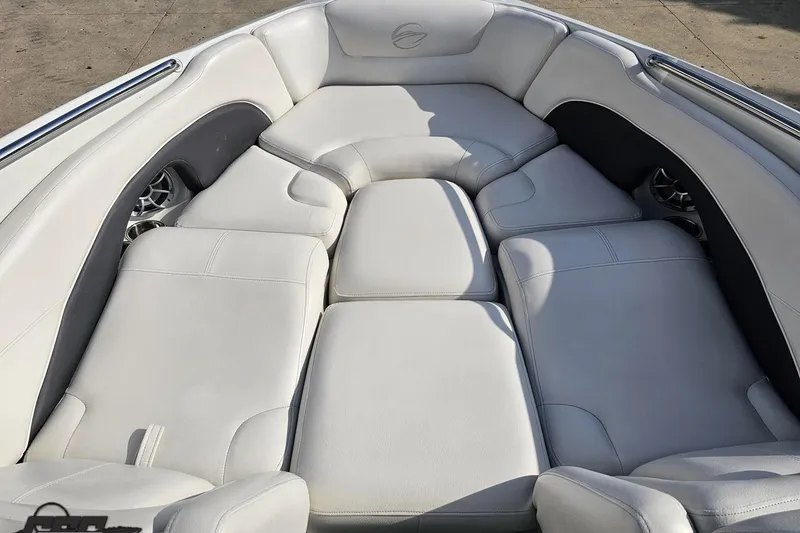 Slide: The Image of Luxurious seating area on a 2019 Crownline 275 SS boat, featuring plush white upholstery. - 89