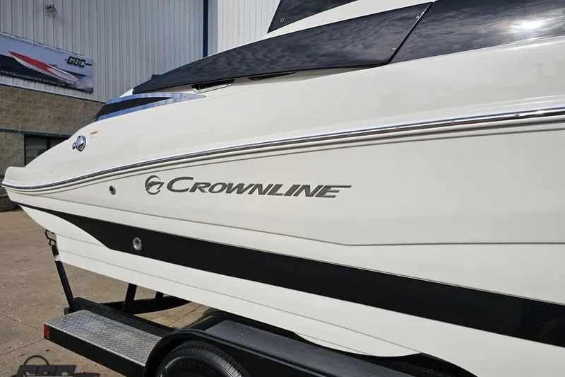 Slide: The Image of 2019 Crownline 275 SS boat side view on trailer. - 9