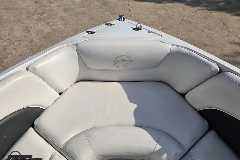 Slide: The Image of 2019 Crownline 275 SS boat with white cushioned seating in the bow area. - 93