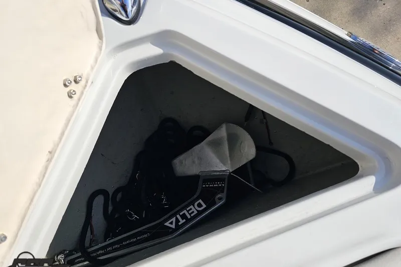Slide: The Image of Storage compartment of a 2019 Crownline 275 SS boat with anchor and rope. - 95