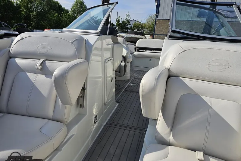 Slide: The Image of 2019 Crownline 275 SS boat interior with white leather seats and sleek design. - 96