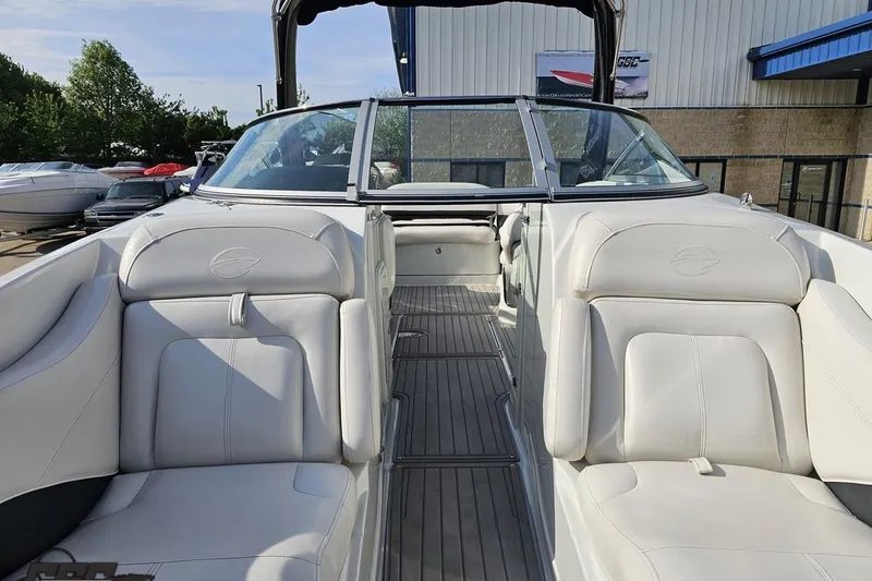 Slide: The Image of 2019 Crownline 275 SS boat interior with white leather seating and sleek design. - 97