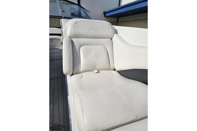 Slide: The Image of 2019 Crownline 275 SS boat with luxurious white seating. - 98