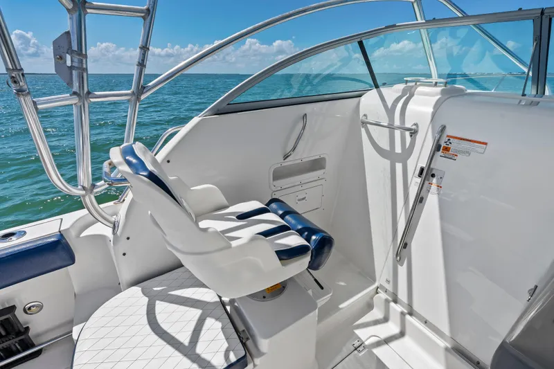 Slide: The Image of 2009 Robalo R245 Walkaround boat interior with helm seat, ocean view. - 14