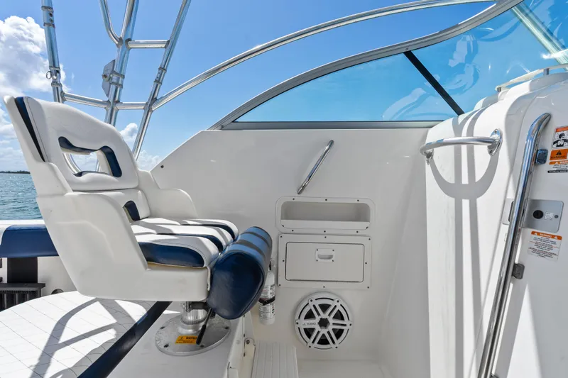 Slide: The Image of 2009 Robalo R245 Walkaround boat interior with captain's chair and control panel. - 15