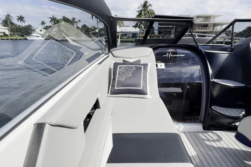 Slide: The Image of Luxurious Hanover 305 yacht interior, 2027 model, featuring sleek seating and elegant design. - 18