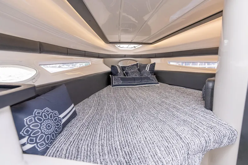 Slide: The Image of Luxurious interior cabin of 2027 Hanover 305 boat with elegant bedding and ambient lighting. - 28