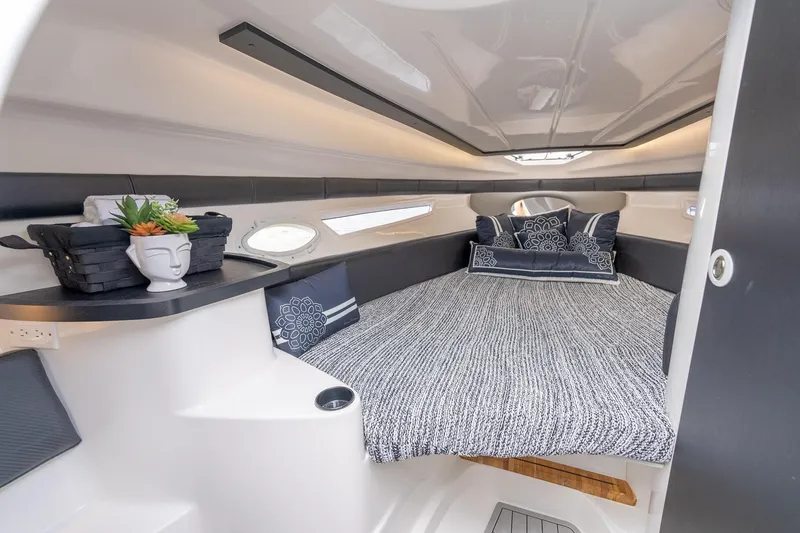 Slide: The Image of Luxurious interior cabin of 2027 Hanover 305 boat with cozy bedding and stylish decor. - 29