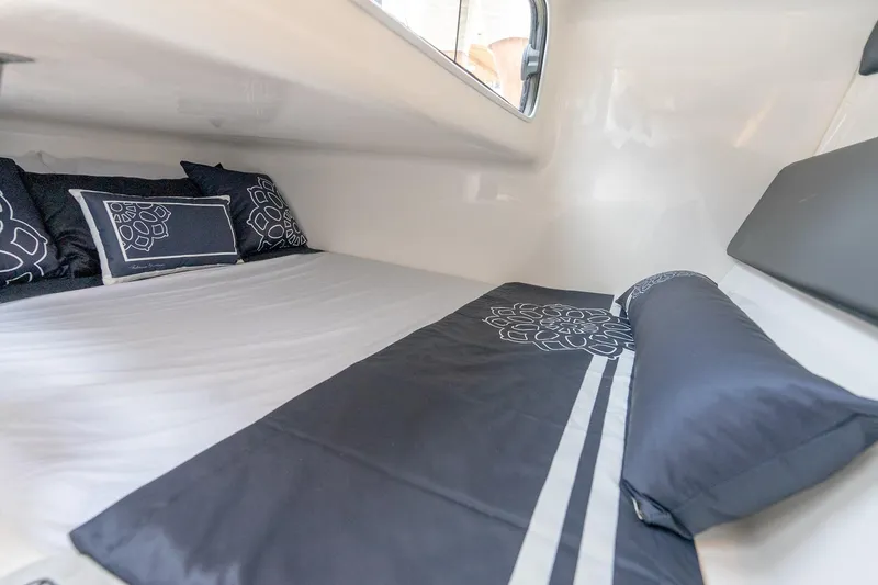 Slide: The Image of Cozy interior cabin of 2027 Hanover 305 with elegant bedding and pillows. - 30