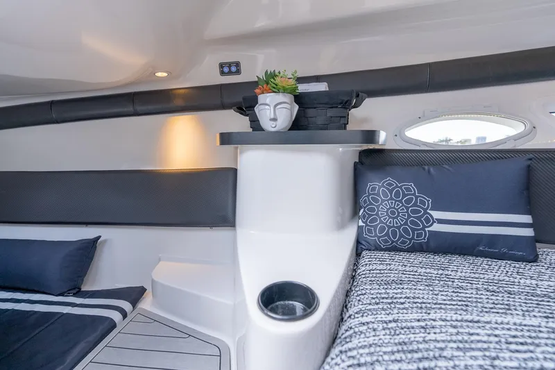 Slide: The Image of Luxurious interior of 2027 Hanover 305 boat with modern decor and comfortable seating. - 31