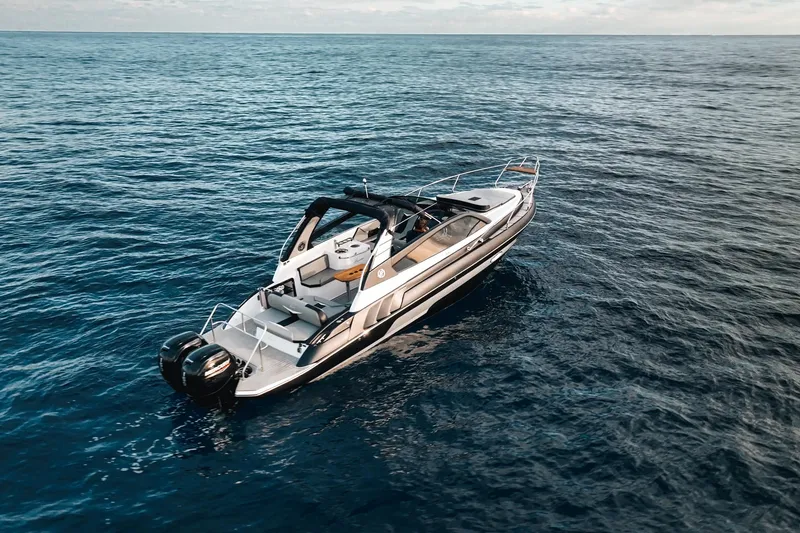 Slide: The Image of Aerial view of 2027 Hanover 305 boat cruising on open sea. - 5