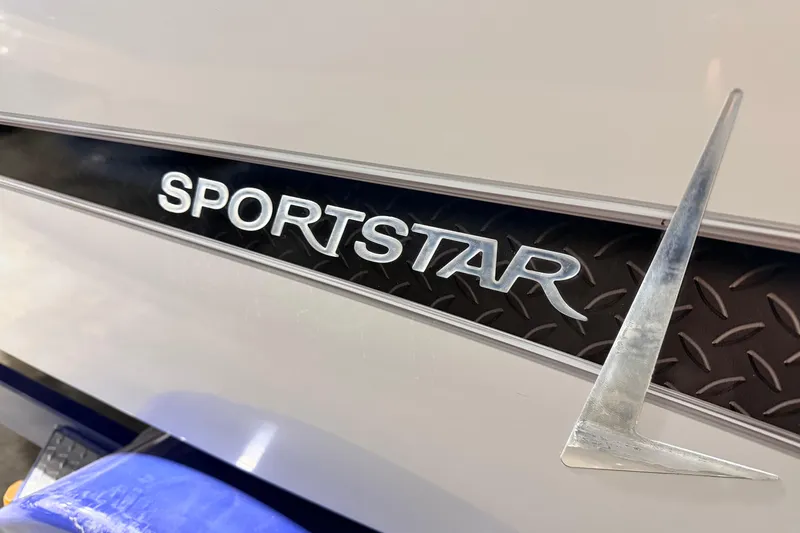Slide: The Image of 2014 Starcraft 2000 IO Limited boat with "Sportstar" emblem detail. - 10