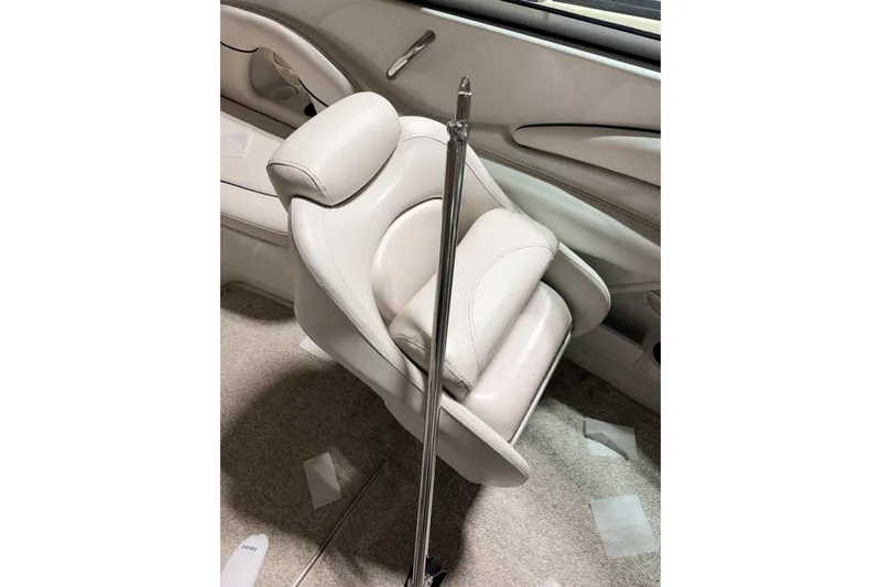 Slide: The Image of Interior of 2014 Starcraft 2000 IO Limited boat with white seating and chrome details. - 20