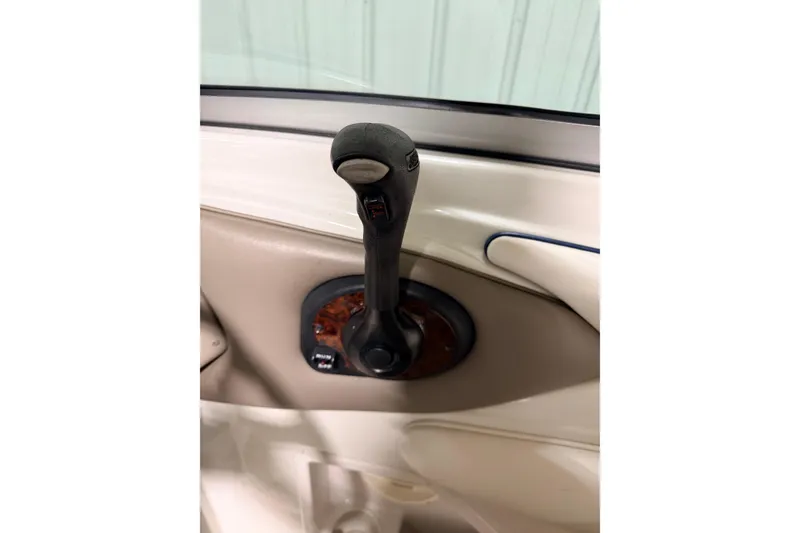 Slide: The Image of 2014 Starcraft 2000 IO Limited throttle control lever in beige interior. - 21