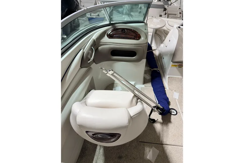 Slide: The Image of Interior of 2014 Starcraft 2000 IO Limited boat, featuring white seating and dashboard. - 22