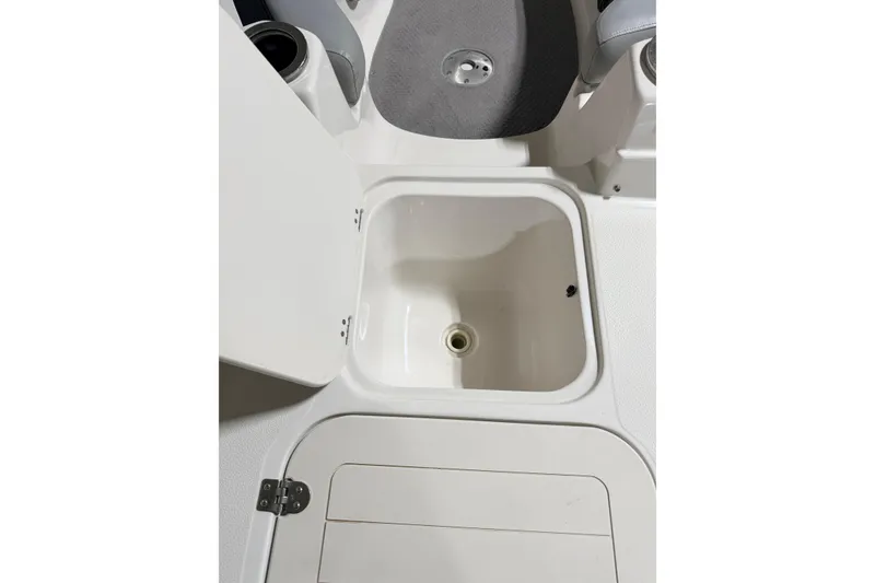Slide: The Image of Open storage compartment on 2014 Starcraft 2000 IO Limited boat. - 26