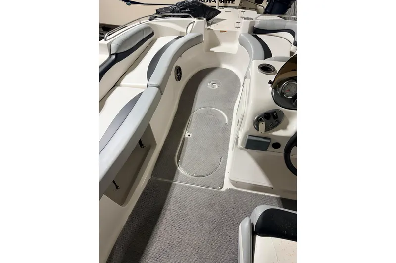 Slide: The Image of 2014 Starcraft 2000 IO Limited boat interior with seating and control panel. - 33