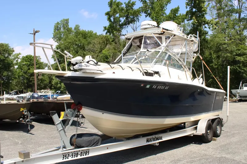 Slide: The Image of 2002 Sea Pro 235WA boat on trailer parked outdoors. - 5